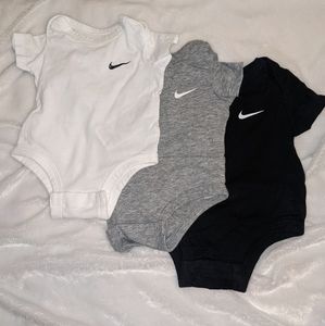 3 Nike onesies
